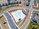 Aerial view of the community pool and clubhouse with parking at 527 Livingston Dr, Lancaster, SC 29720