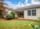 The backyard features mature trees and a covered patio at 527 Livingston Dr, Lancaster, SC 29720