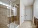 Bathroom featuring tile shower with glass door, and tile flooring in the bath area at 527 Livingston Dr, Lancaster, SC 29720