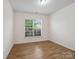 Cozy bedroom with wood floors, natural light, and a neutral color palette at 527 Livingston Dr, Lancaster, SC 29720