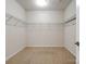 Walk-in closet with wire shelving and carpeted floor in a well-lit space at 527 Livingston Dr, Lancaster, SC 29720