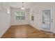 Sunlit dining area featuring hardwood floors and an access door to the backyard at 527 Livingston Dr, Lancaster, SC 29720