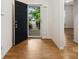 Inviting entryway with dark wood door that opens to a light-filled living space at 527 Livingston Dr, Lancaster, SC 29720