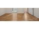 Hardwood hallway with neutral paint leads to various rooms and doors in the home at 527 Livingston Dr, Lancaster, SC 29720