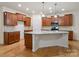 Bright, open kitchen with a center island, granite countertops, stainless steel appliances, and hardwood floors at 527 Livingston Dr, Lancaster, SC 29720