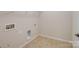 A bright laundry room offers hookups and space for storage at 527 Livingston Dr, Lancaster, SC 29720