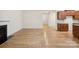 Open living space showing fireplace, hardwood floors and kitchen cabinets at 527 Livingston Dr, Lancaster, SC 29720