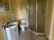 Bathroom with single vanity, toilet, and glass enclosed shower at 539 Jennings Rd, Statesville, NC 28625