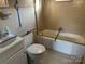 Modest bathroom features a shower-tub combination and a classic white vanity, offering functionality at 539 Jennings Rd, Statesville, NC 28625