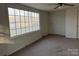 Sunlit living room featuring carpet, a large window, and neutral walls at 539 Jennings Rd, Statesville, NC 28625