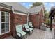 Back deck featuring an outdoor spa with comfortable patio furniture at 5629 Berry Ridge Dr, Harrisburg, NC 28075