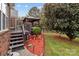Inviting backyard features a gazebo and lush landscaping creating a serene outdoor living space at 5629 Berry Ridge Dr, Harrisburg, NC 28075