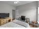 Bedroom featuring a desk, wood floors, and a TV at 5629 Berry Ridge Dr, Harrisburg, NC 28075