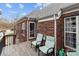 Charming deck with chairs offers an inviting space to enjoy the fresh air and views at 5629 Berry Ridge Dr, Harrisburg, NC 28075