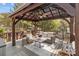 Cozy gazebo with comfortable seating, creating an inviting outdoor living area at 5629 Berry Ridge Dr, Harrisburg, NC 28075