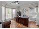Bright home office features large windows and hardwood floors at 5629 Berry Ridge Dr, Harrisburg, NC 28075
