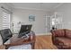 Spacious home office features hardwood floors and is brightly lit at 5629 Berry Ridge Dr, Harrisburg, NC 28075