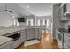 Bright kitchen featuring granite countertops, stainless steel appliances, and hardwood flooring at 5629 Berry Ridge Dr, Harrisburg, NC 28075