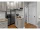 Kitchen with stainless steel refrigerator, granite countertops and a built-in wine rack at 5629 Berry Ridge Dr, Harrisburg, NC 28075