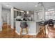 Bright eat-in kitchen features granite counters, breakfast bar, and stainless steel appliances at 5629 Berry Ridge Dr, Harrisburg, NC 28075