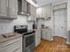This modern kitchen boasts stainless steel appliances and granite countertops at 5629 Berry Ridge Dr, Harrisburg, NC 28075