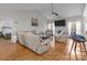 Spacious living room with hardwood floors, a vaulted ceiling, and an open layout at 5629 Berry Ridge Dr, Harrisburg, NC 28075