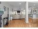 Inviting living room with hardwood floors, neutral walls, open concept kitchen and plenty of light at 5629 Berry Ridge Dr, Harrisburg, NC 28075