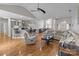 Open-concept living space with hardwood floors, a modern kitchen, and comfortable seating at 5629 Berry Ridge Dr, Harrisburg, NC 28075
