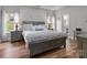 Beautiful main bedroom suite features hardwood floors and natural lighting at 5629 Berry Ridge Dr, Harrisburg, NC 28075