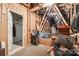 Unfinished attic space for storage with exposed beams, and plywood walls ready for customization at 6024 Glenmore Garden Dr, Charlotte, NC 28270