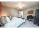 Comfortable bedroom offering natural light, a ceiling fan, and ample space for relaxation and work at 6024 Glenmore Garden Dr, Charlotte, NC 28270