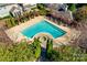 Aerial view of a community pool and spa, surrounded by landscaping and covered lounging areas at 6024 Glenmore Garden Dr, Charlotte, NC 28270