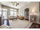 Bright living room with large windows, ceiling fan, hardwood floors, and neutral decor at 6024 Glenmore Garden Dr, Charlotte, NC 28270