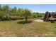 Expansive fenced backyard with a deck, tree, and plenty of space for outdoor activities at 6061 Piscataway Ct, Rock Hill, SC 29732