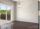 Dining area with sliding glass doors leading to a deck and dark wood flooring at 6061 Piscataway Ct, Rock Hill, SC 29732