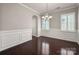 Cozy dining room features hardwood floors, paneled walls, and a chandelier at 6061 Piscataway Ct, Rock Hill, SC 29732