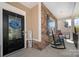 Welcoming front entrance with a blue wreath and 'Welcome' sign, complemented by stone detailing at 6061 Piscataway Ct, Rock Hill, SC 29732