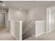 Hallway with neutral carpeting, a staircase, and white trim at 6061 Piscataway Ct, Rock Hill, SC 29732
