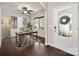 Bright home office with a ceiling fan, built-in cabinets, and large windows overlooking the front yard at 6061 Piscataway Ct, Rock Hill, SC 29732