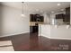 Bright kitchen with granite countertops, stainless steel appliances, and dark wood cabinets at 6061 Piscataway Ct, Rock Hill, SC 29732
