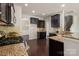 Open concept kitchen featuring granite countertops, stainless steel appliances, and hardwood floors at 6061 Piscataway Ct, Rock Hill, SC 29732