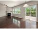 Bright living room with hardwood floors, a fireplace, and sliding glass doors leading to a deck at 6061 Piscataway Ct, Rock Hill, SC 29732