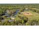 Great aerial view featuring a baseball park with water features in a forested area at 6127 Rosecrest Dr, Charlotte, NC 28210