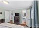 Bedroom showcasing hardwood floors, natural light and an adjacent bathroom at 6127 Rosecrest Dr, Charlotte, NC 28210