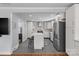 Open-concept kitchen featuring a center island, stainless steel appliances, and seamless flow into adjacent living spaces at 6127 Rosecrest Dr, Charlotte, NC 28210