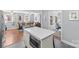 Spacious kitchen island with seating and view into the living room, ideal for entertaining and everyday living at 6127 Rosecrest Dr, Charlotte, NC 28210