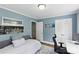 Office space offers natural light, hardwood floors, built in storage, and a sofa at 6127 Rosecrest Dr, Charlotte, NC 28210