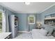 Office space offers natural light, hardwood floors, built in storage, and a sofa at 6127 Rosecrest Dr, Charlotte, NC 28210
