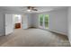 Bright bedroom with carpet, natural light, double windows, and an en-suite bathroom at 6204 River Birch Dr, Gastonia, NC 28056