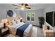 Primary bedroom with neutral walls, two windows, and a ceiling fan at 6204 River Birch Dr, Gastonia, NC 28056